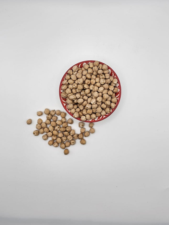 Dry chickpeas from The Fusion Mart UK in 500g, 1kg, 2kg, or 5kg packs, shown in a clear image with chickpea beans.